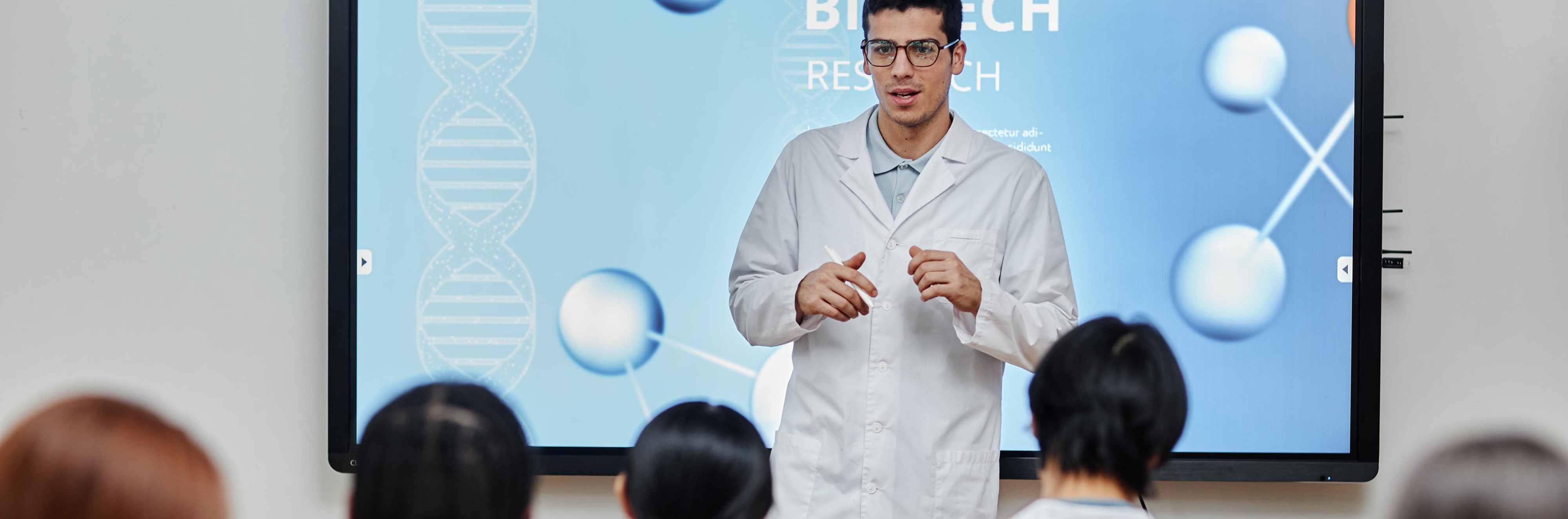A scientist presenting to a crowd